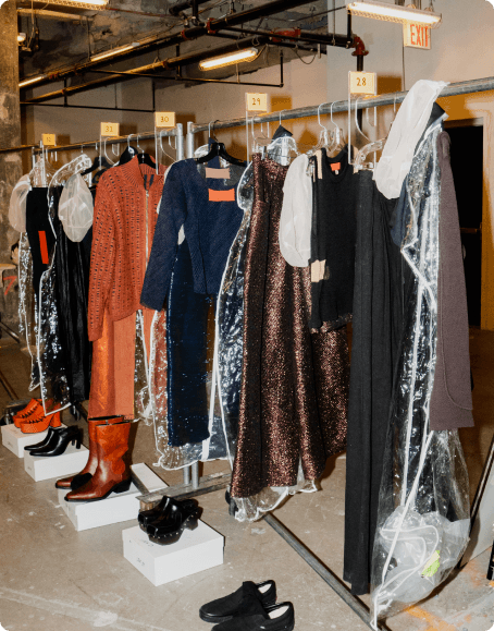 Pieces from the Eckhaus Latta SS24 collection wait to be worn on the runway, including a pair of 3D woven Tinsel pants.